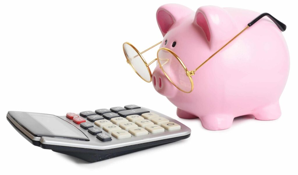 Piggy bank with glasses and calculator 1024x602 - Want more bang for your buck with your MES software?